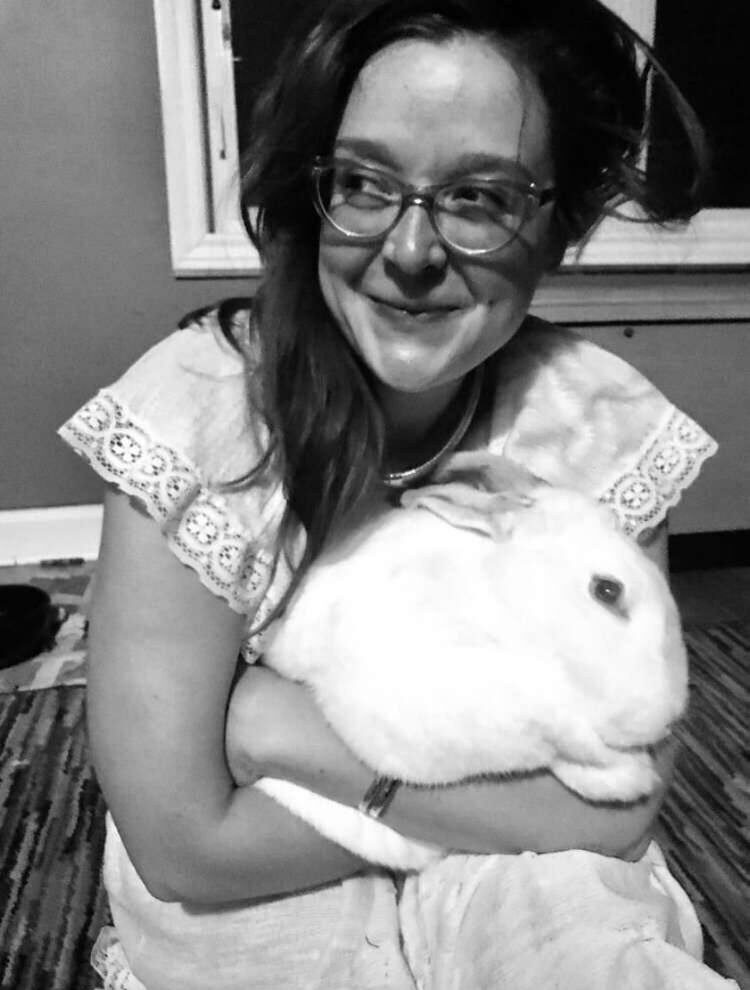 A photo of Romps holding a bunny. Photo by Casey Comeau